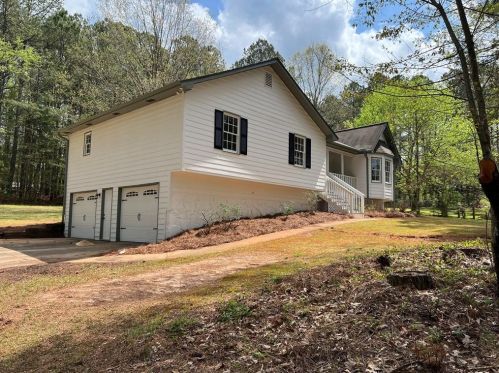 504 Honeysuckle Ln, Holly Springs, GA 30188-1764